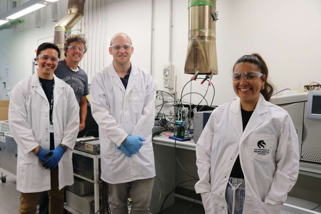 Founder Isabel Toasa standing with EM Energy CEO Chris Wilson and researchers