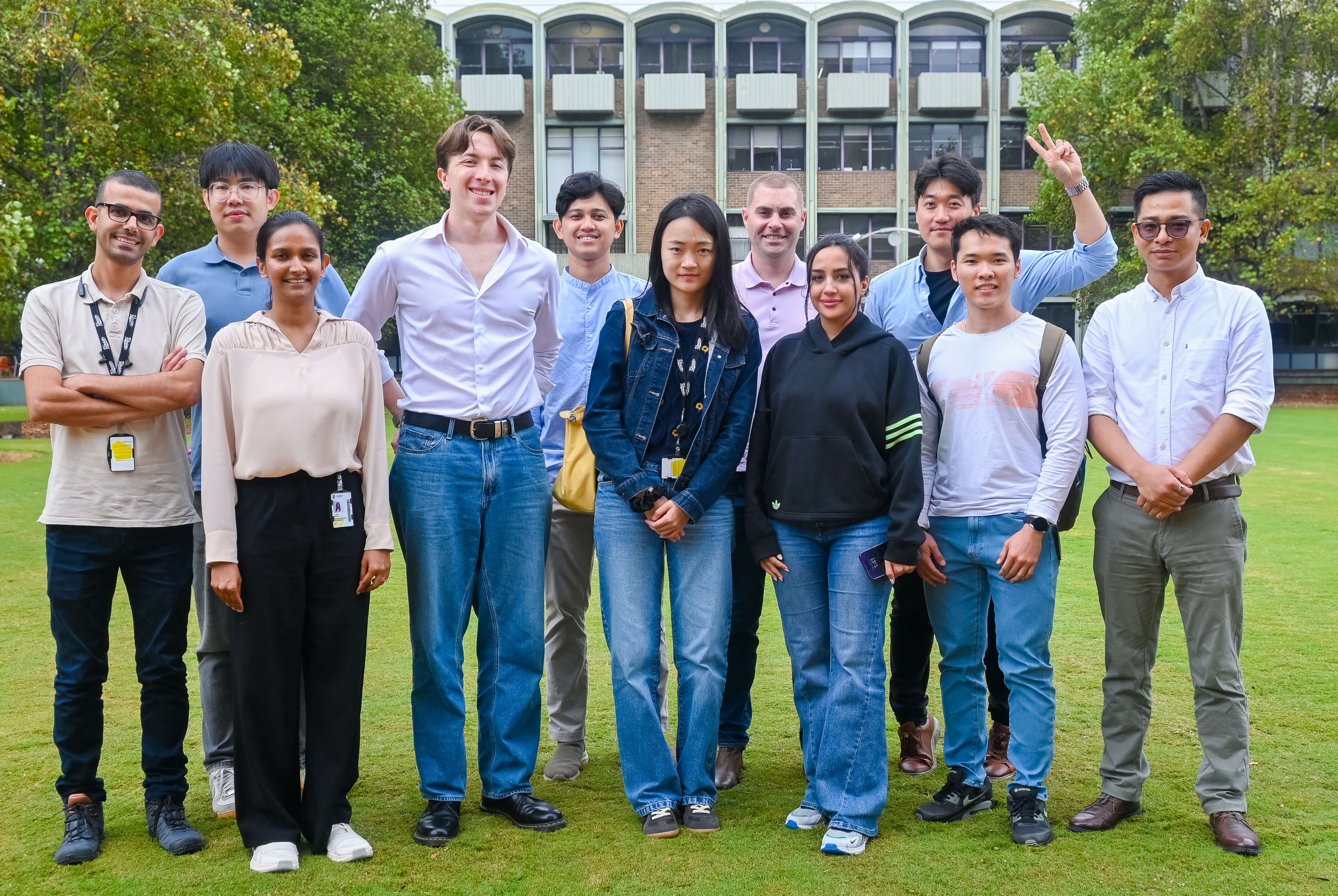 The HDR cohort standing together and smiling.