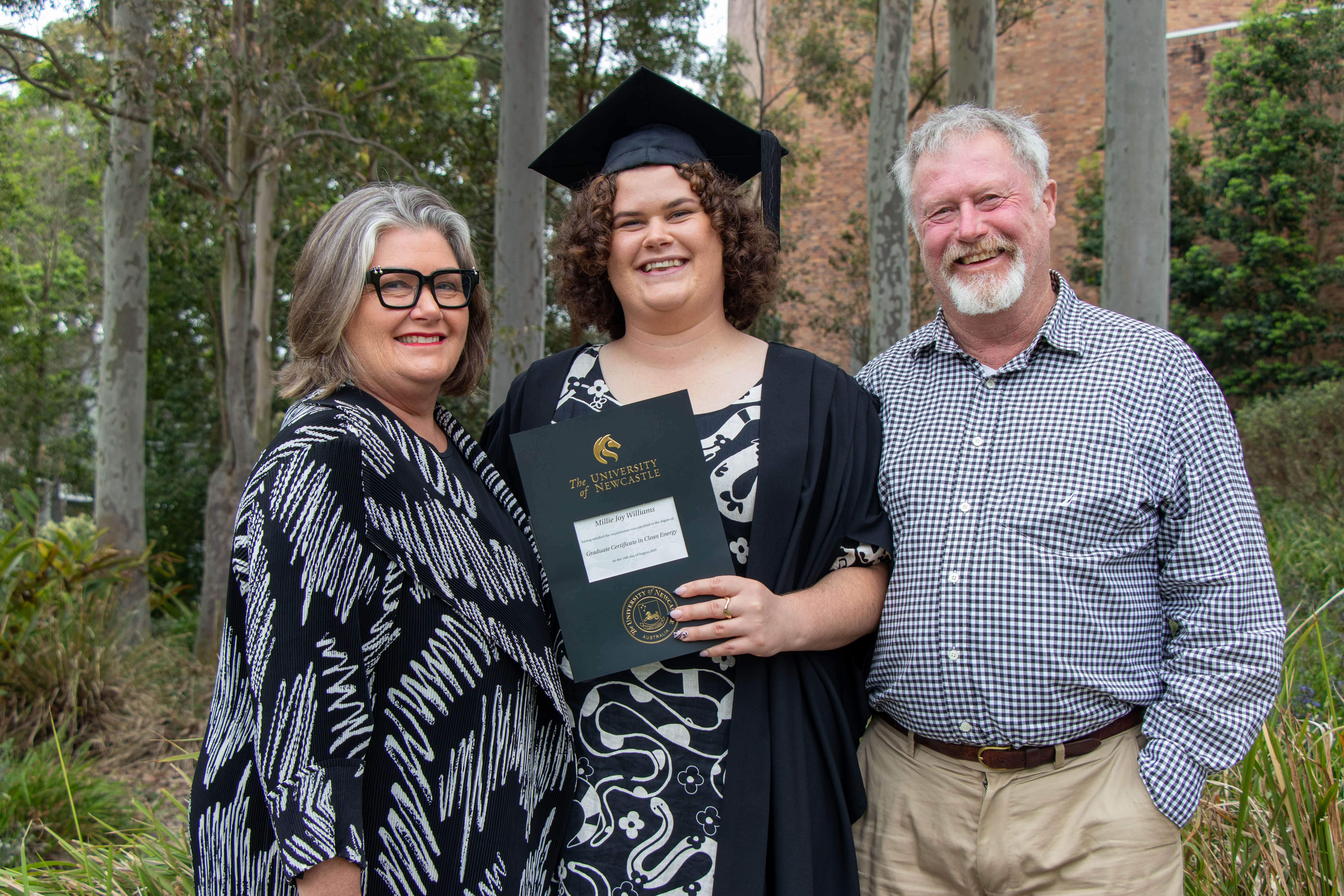 University of Newcastle's first clean energy graduate, Millie Williams with her family